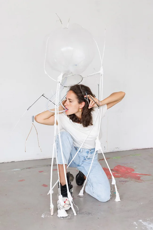 Sophie Schmidt: complexification, becoming mosquito I, 2022 performance with object (branches, plaster, tape, plastic bags, vinyl tubes, lipstick, tampons, fork, caffetiera, shoe)